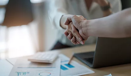 Business hand shaking agreement