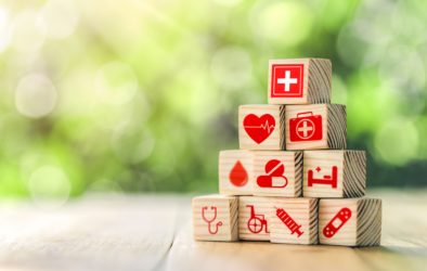 Lay out wooden blocks with icons of medical health. health insurance for your health concept. Healthcare medical business, medical technology equipment icon, health care protection concept.