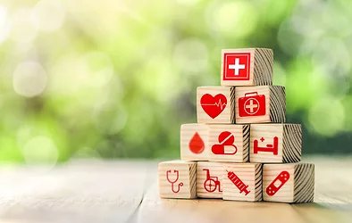 Lay out wooden blocks with icons of medical health. health insurance for your health concept. Healthcare medical business, medical technology equipment icon, health care protection concept.