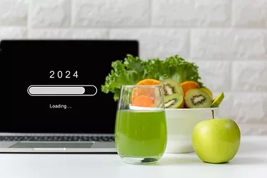 Loading year 2024 for start new business and new life. Healthy fresh healthy salad and vegetable green water.