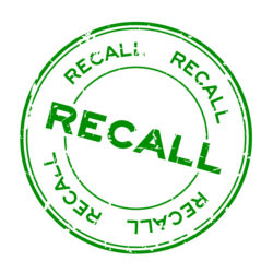Grunge green recall round rubber seal stamp on white background