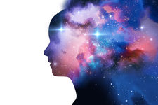 silhouette of virtual human with aura chakras on space nebula, represent meditation, yoga and deep sleep therapy.