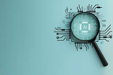Magnifying Glass Focused on Circuit Board with AI Word, Representing Artificial Intelligence and Technology Innovation.