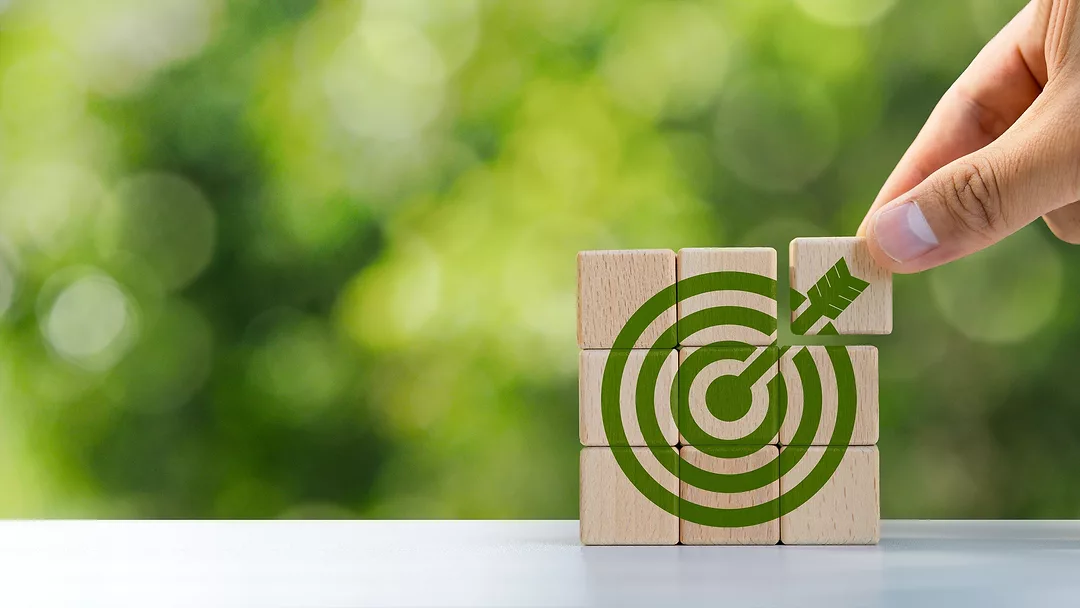 Environmental goals of green business Business development strategy with sustainable environmental conservation wooden block on handle