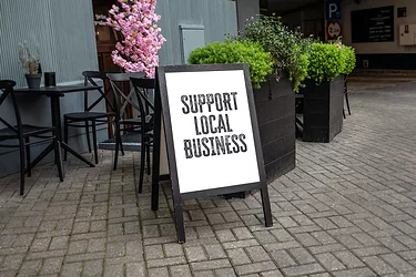 Support Local Business. Advertising banner on the street.