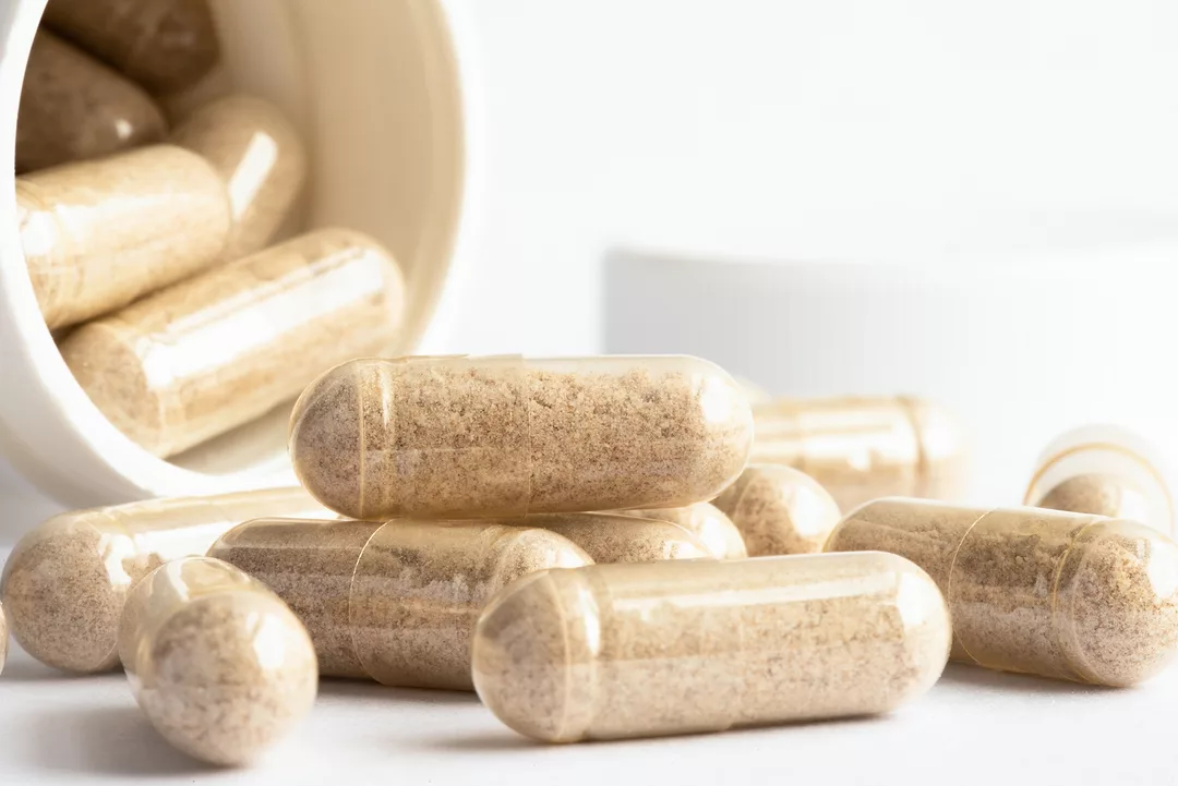 Saw Palmetto Capsules Spilled from a Bottle