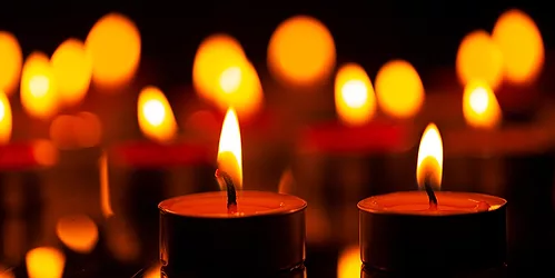 Memoriam-candles-GettyImages-1440570757.jpg